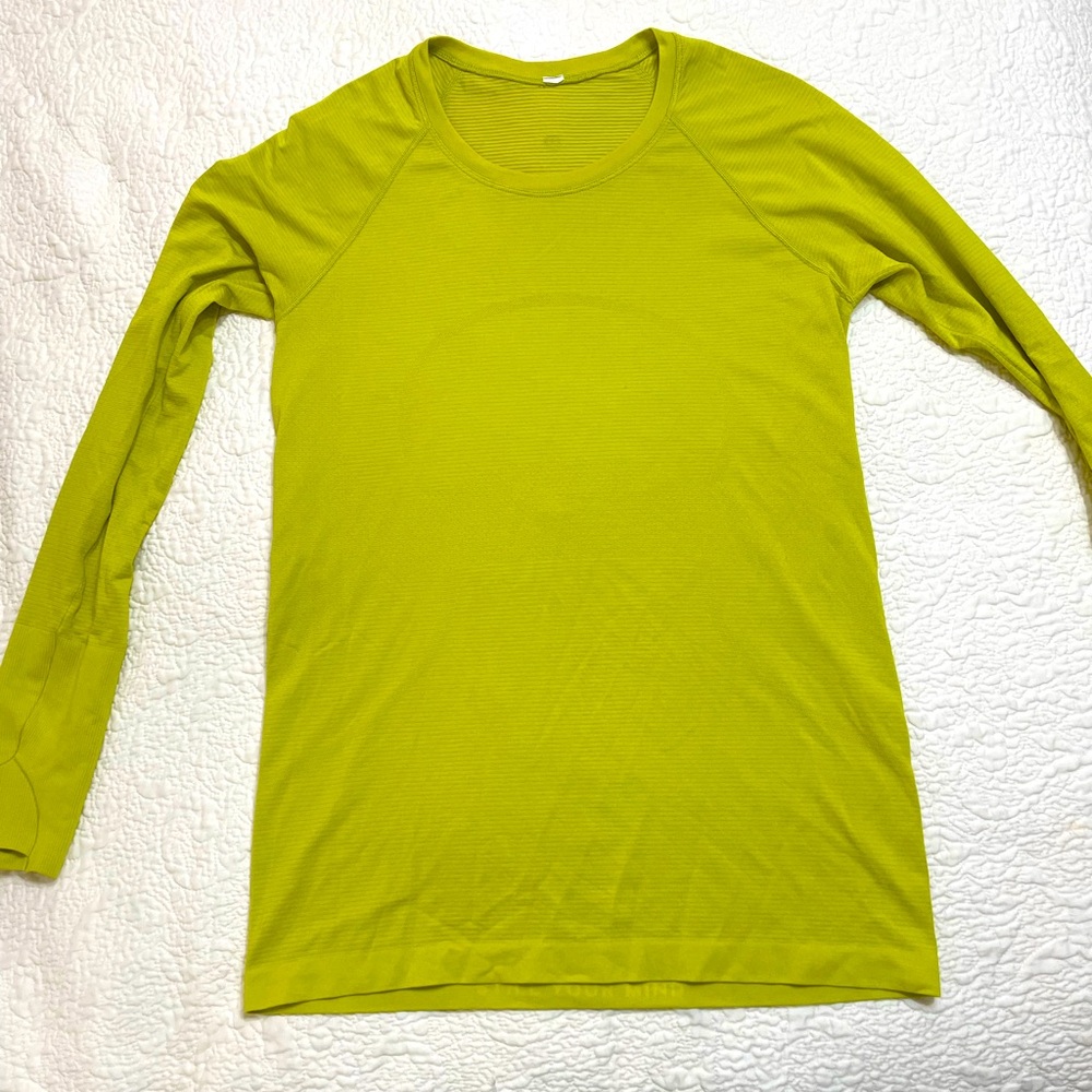 Lululemon long sleeve work out top. No stains. Great condition. Lemon lime color